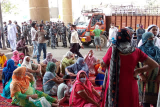 Villagers protested by sitting in road of metro station