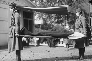 This photo made available by the Library of Congress shows a demonstration at the Red Cross Emergency Ambulance Station in Washington during the influenza pandemic of 1918.