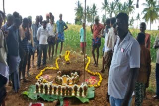 The villagers doing pooja in lake for rain