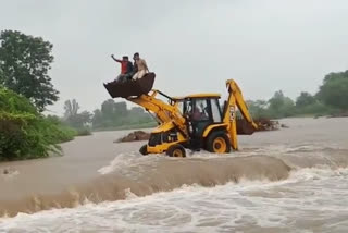 Rescue of children trapped in water through JCB