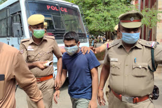 Air Force lieutenant Amitesh Harmukin being taken to the court