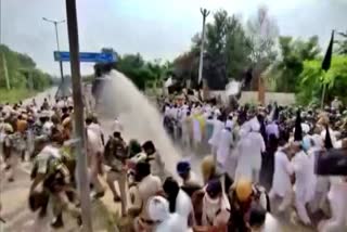 Police use water cannon to disperse farmer protesters