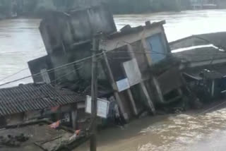 ghatal flood:  two storied building submerged under water after continuous rain