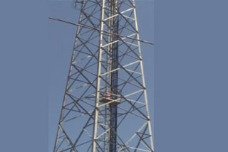 Man climbs cell tower at Vijayawada Benz Circle