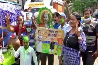TMC supporters celebrate outside CM Mamata Banerjees residence in Kolkata