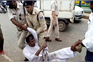 protester and police scuffle