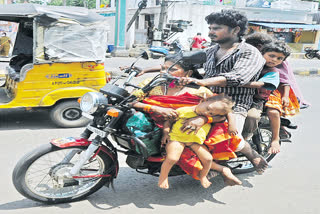 Five people on a two-wheeler in a dangerous situation