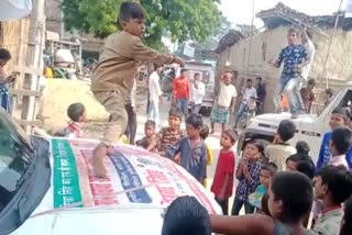 child danced on car bonnet