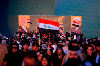 Followers of a political movement called "Al-Fateh Alliance" chant during a rally before the parliamentary elections in Baghdad, Iraq, Thursday, Oct. 7, 2021. Iraq on Sunday, Oct. 10, holds its fifth election since the 2003 U.S.-led invasion that toppled Iraqi dictator Saddam Hussein, with most Iraqis longing for real change.