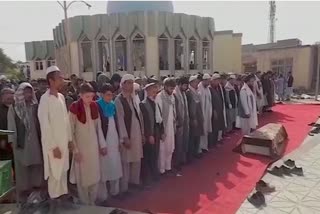 Funeral prayers for those killed in a suicide attack at a mosque in Kunduz