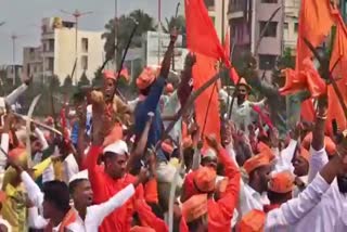 Hindu organizations Activists dance with a Talwar