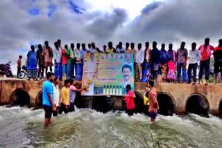 Villagers made anointing of milk on Minister Madhuswamy photo