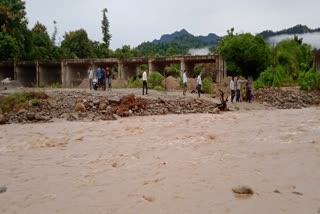 gmo-bus-stuck-in-sigaddi-river-on-laldhang-chillarkhal-motorway