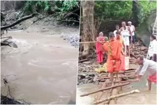 bridge-washed-out-from-heavy-rain-causes-problems-to-reach-temple