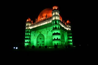 gol gumbaz decorated with tricolor lighting