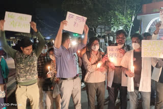 Candle march in protest against the killing of security guard