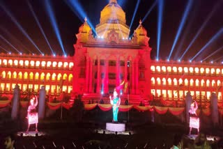 Vidhana soudha adorned with red and yellow electric lighting