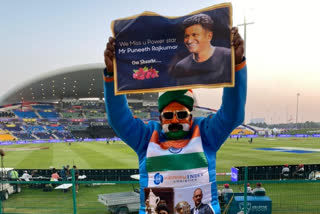 Puneeth Rajkumar photo displayed by cricket  fan in Abu Dhabi