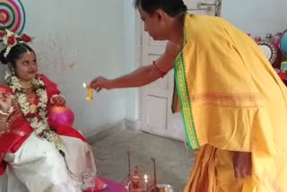 father worships his daughter as devi Lakshmi at Gobardanga