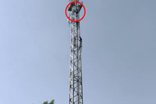 man-climbed-on-mobile-tower
