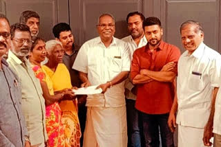 Actor Surya presents a cheque for Rs 15 lakh  the real character of Jai Bhim movie
