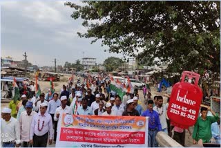 ripun bora led a foot rally  against bjp