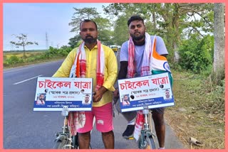 two young boys bycycle rally to guwahati