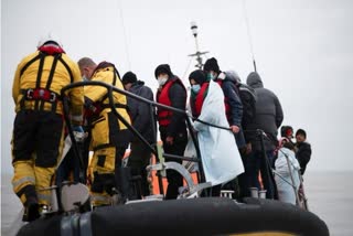 At least 27 migrants dead and others missing after boat sinks off French coast