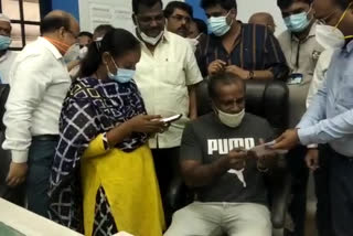 A man takes vaccine after getting Guarantee Letter