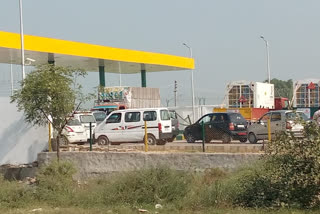 People queue at Dhansa CNG pump in delhi