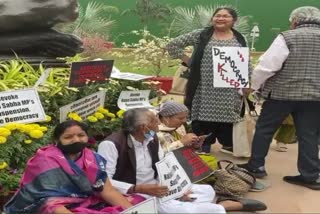 Suspended Rajya Sabha MPs protesting