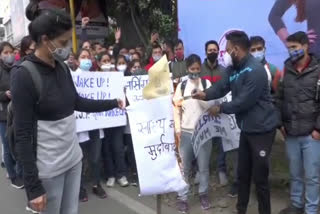 students burnt effigy of Dhan Singh Rawat