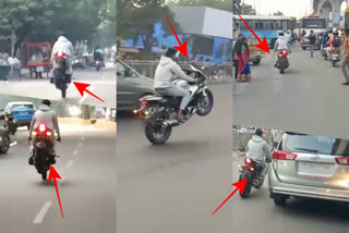 man stunts on roads with bike