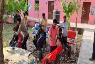 Barber cuts hair in Bhilwara government school
