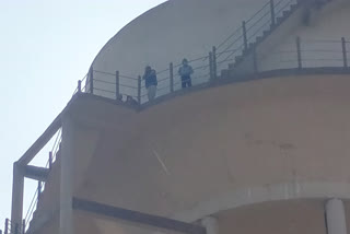 Farmer climbed with family on water tank