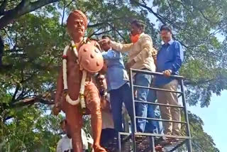 MLA abhaya patila pouring milk on Rayanna statue