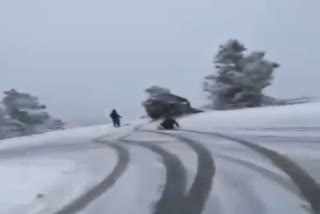 Jeep skids off on snow