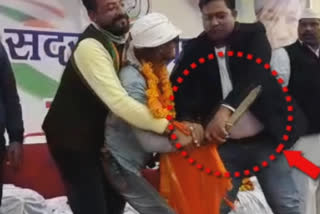 Uttarakhand Person gets up on stage brandishing knife in Congress programme