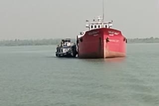 barge and boat collide head on in the middle of the river