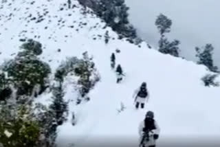 Indian Army troops patrolling along the LoC under heavy snowfall