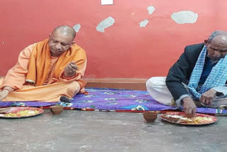 yogi adityanath takes lunch with dalit bjp worker in gorakhpur