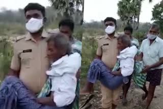 SI saved old man from mud Telangana Warangal  Warangal SI viral video  ചെളിയില്‍ കഴിഞ്ഞ വൃദ്ധനെ രക്ഷിച്ച് വാറങ്കല്‍ എസ്‌.ഐ  ഹൈദരാബാദ് ഇന്നത്തെ വാര്‍ത്ത  warangal si Bandari Raju viral on social media