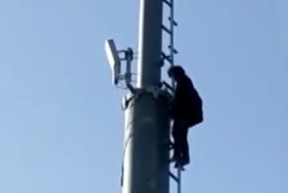 Man Climbs Cell Tower