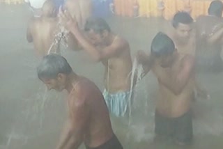 devotees holy bath in Ganga river