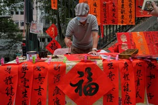 Calligraphic banners add to the beauty of streets in Hong Kong, Chinese calligraphy Fai Chun, lunar new year china