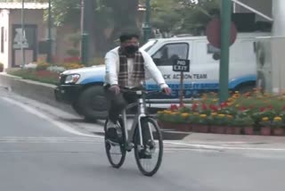 Union Health Minister Mansukh Mandaviya rides a bicycle