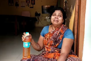 a women protest with petrol bottle