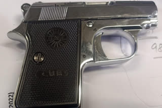 man travelled with pistol and bullet magazine from dubai arrested at delhi airport