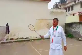 Satpal Brahmachari playing badminton