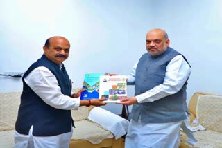 cm-bommai-issued-the-government-report-card-to-amit-shah